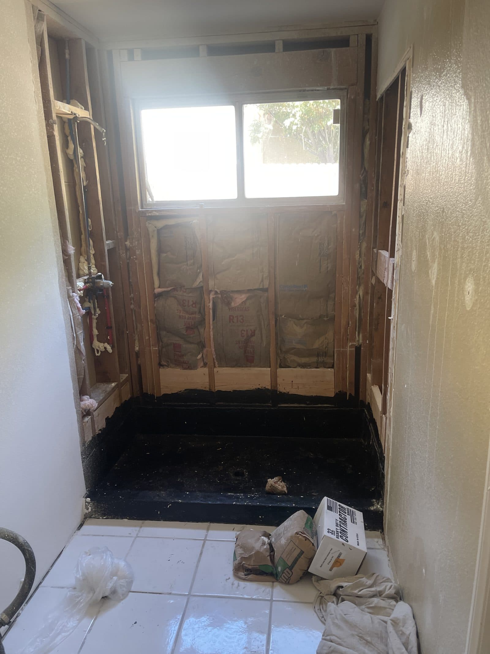 Water and fire damage preconstruction site in the Inland Empire, stripped to studs after mitigation — photo 6