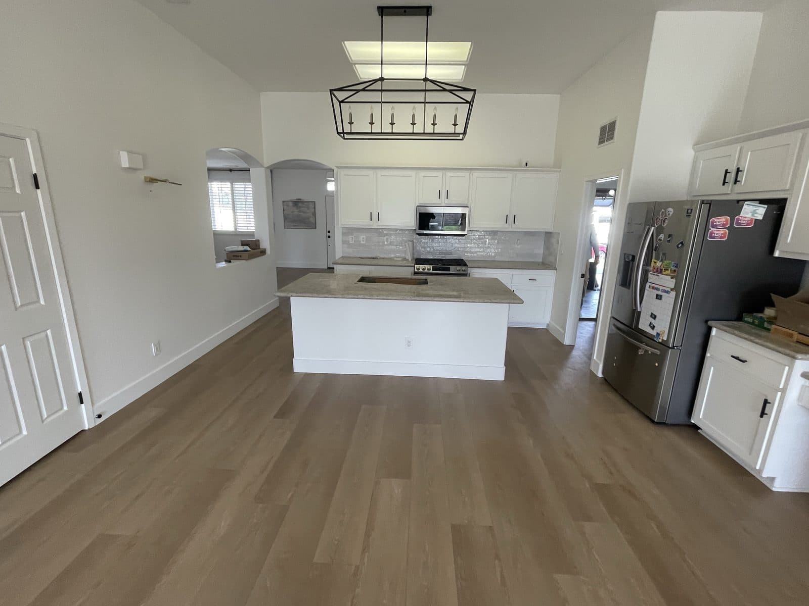 Completed kitchen rebuild in Corona CA with new cabinets, quartz counters and luxury vinyl plank flooring — photo 2
