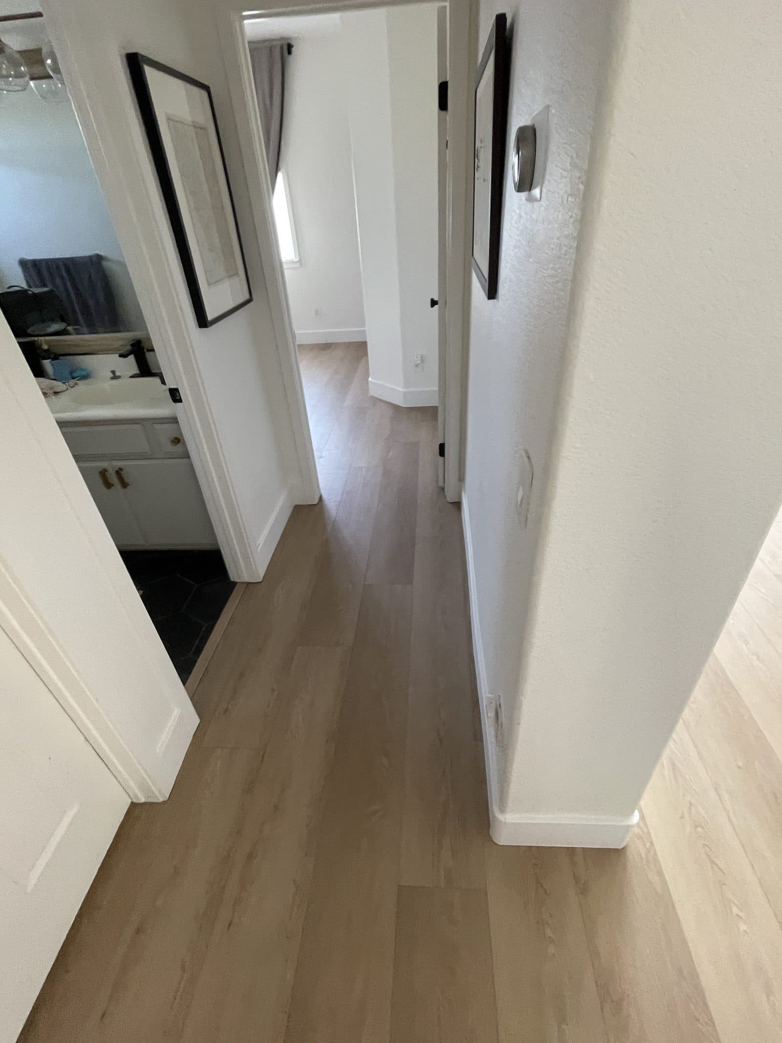 Completed kitchen rebuild in Corona CA with new cabinets, quartz counters and luxury vinyl plank flooring — photo 4