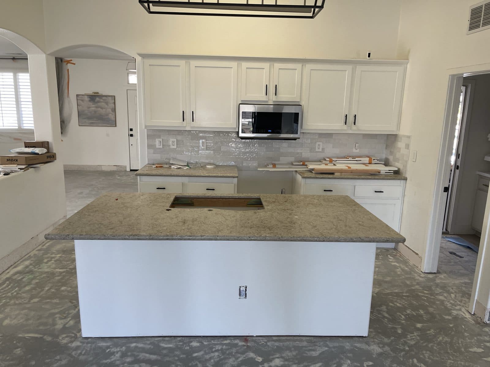 Water damaged kitchen in Corona CA stripped after mitigation, before insurance claim rebuild — photo 5