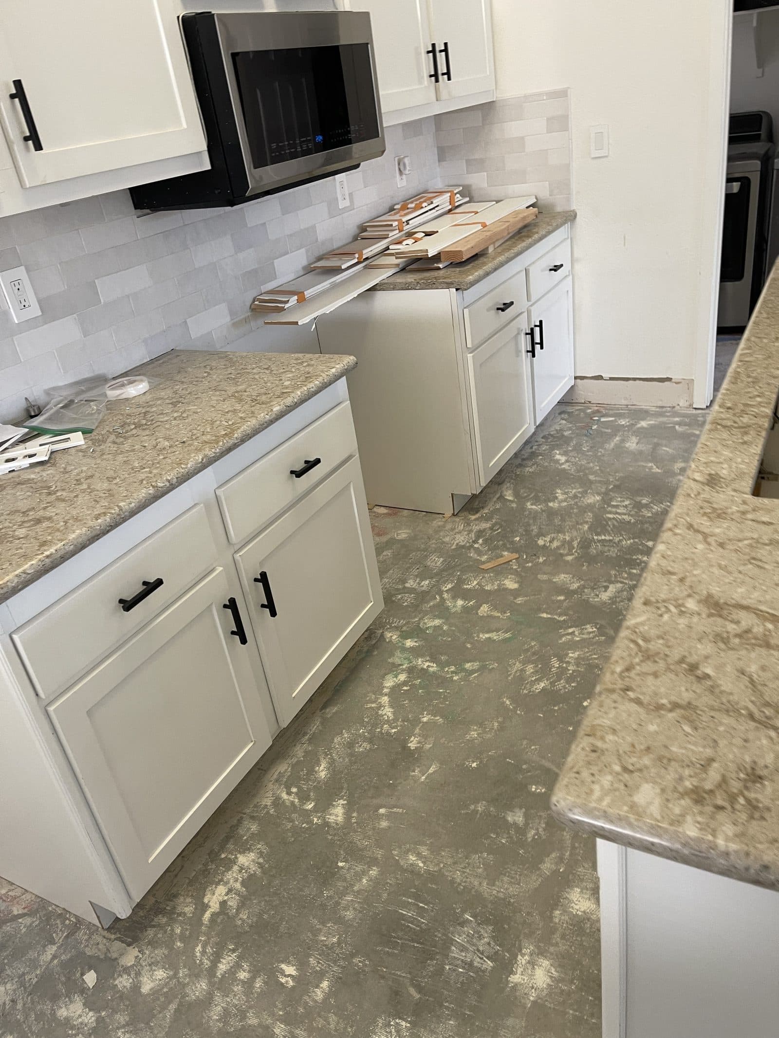 Water damaged kitchen in Corona CA stripped after mitigation, before insurance claim rebuild — photo 6