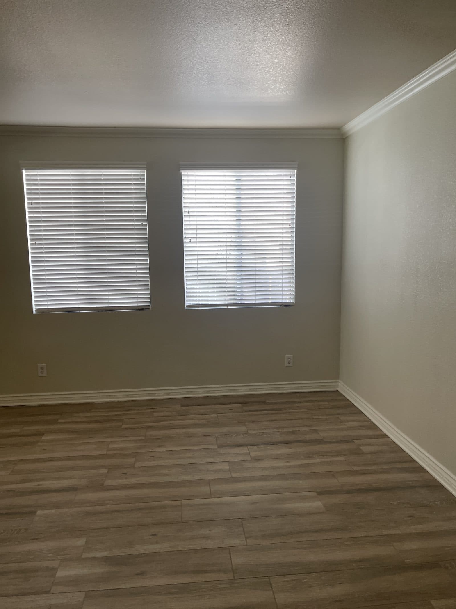 New luxury vinyl plank flooring installed in Corona CA home after water damage rebuild — photo 1