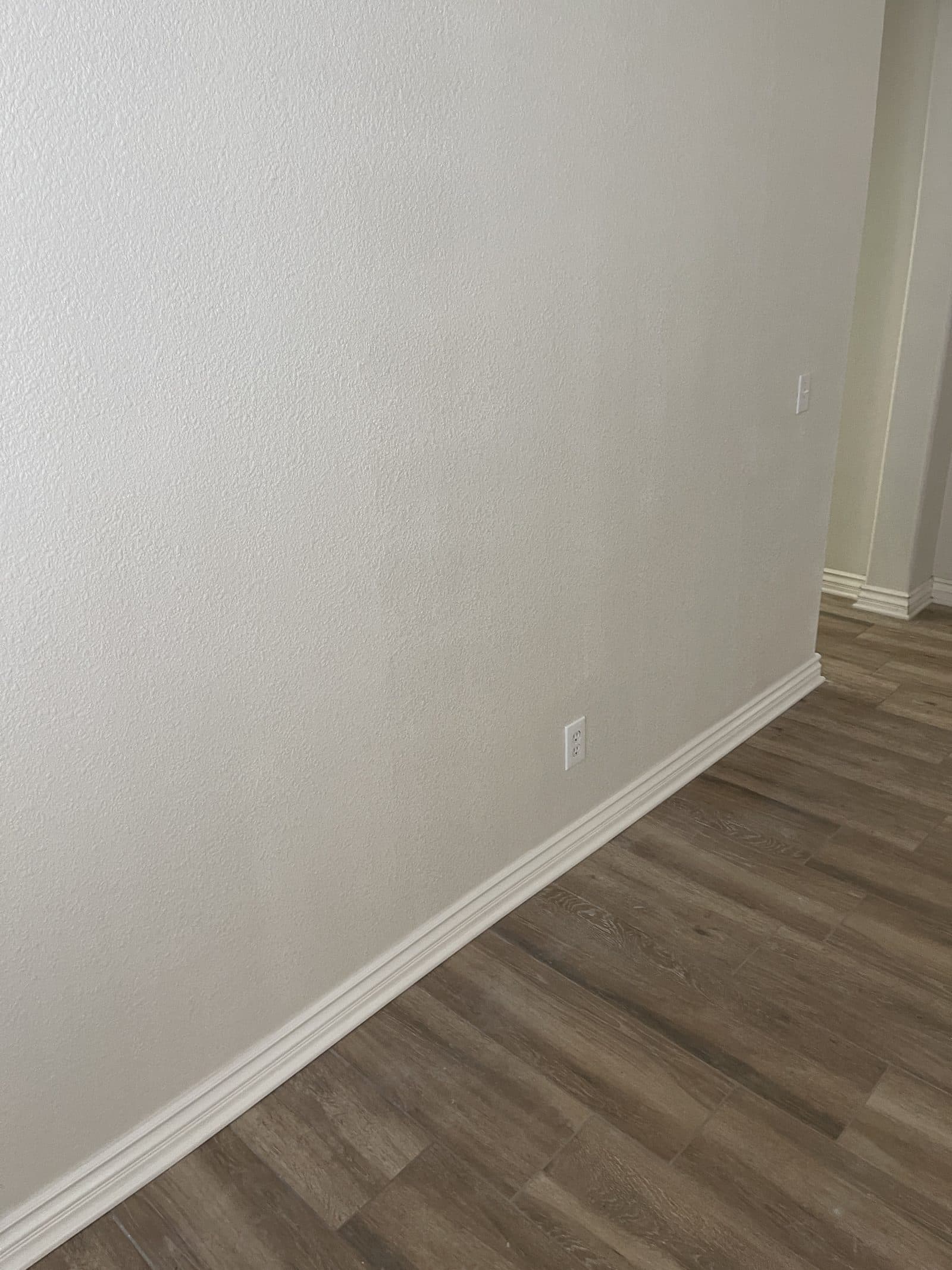 New luxury vinyl plank flooring installed in Corona CA home after water damage rebuild — photo 3