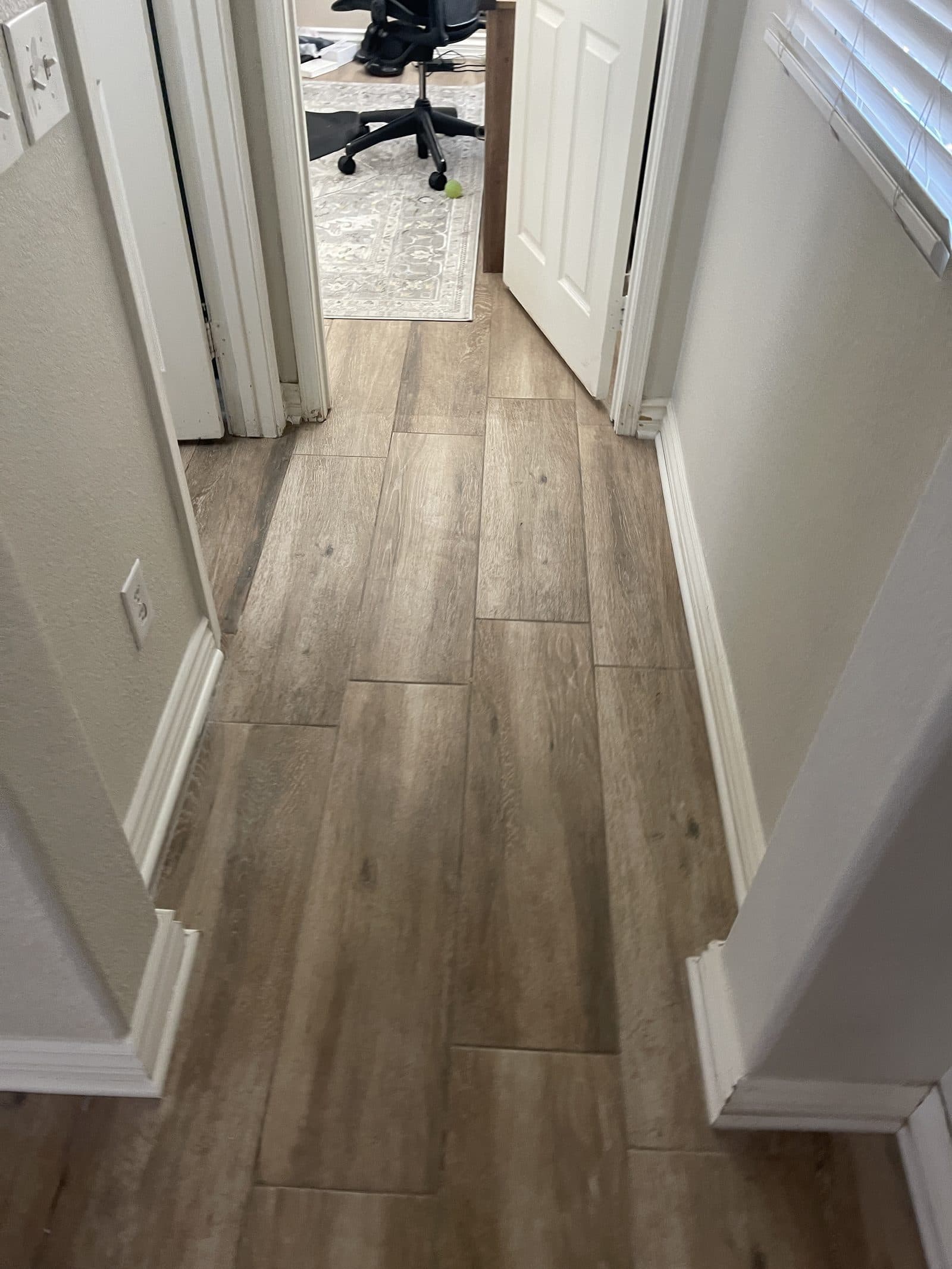 New luxury vinyl plank flooring installed in Corona CA home after water damage rebuild — photo 4