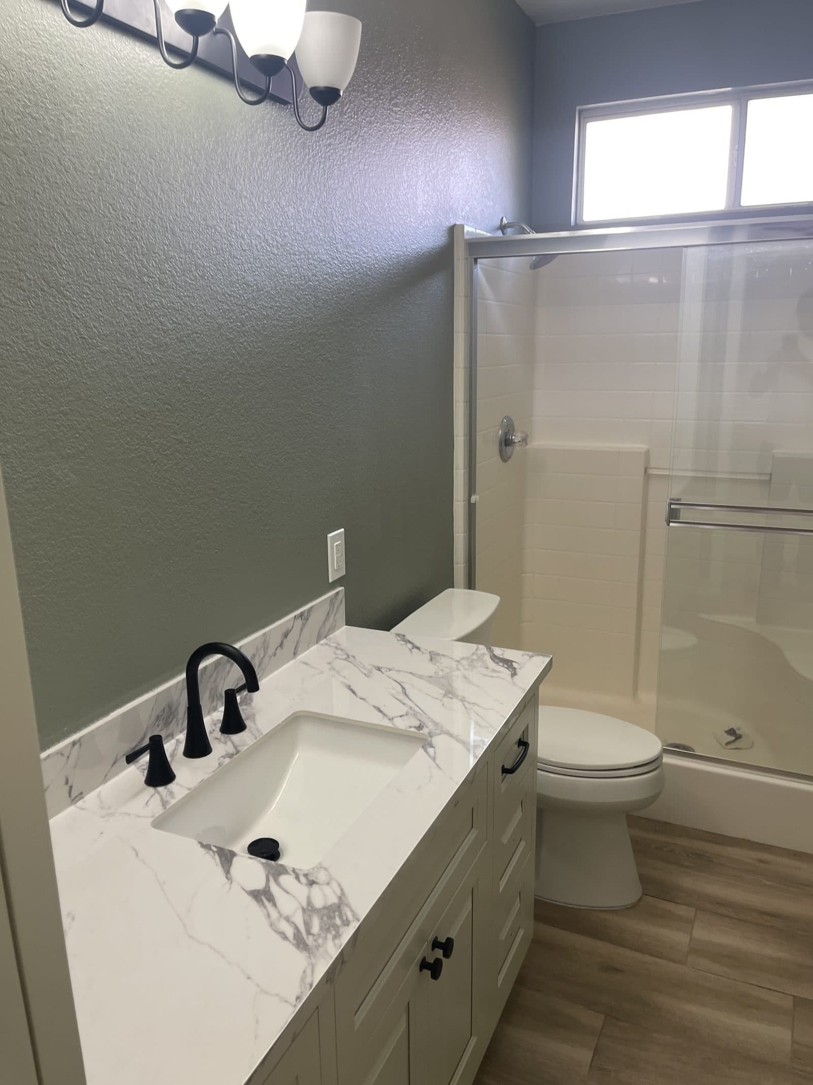 New luxury vinyl plank flooring installed in Corona CA home after water damage rebuild — photo 5