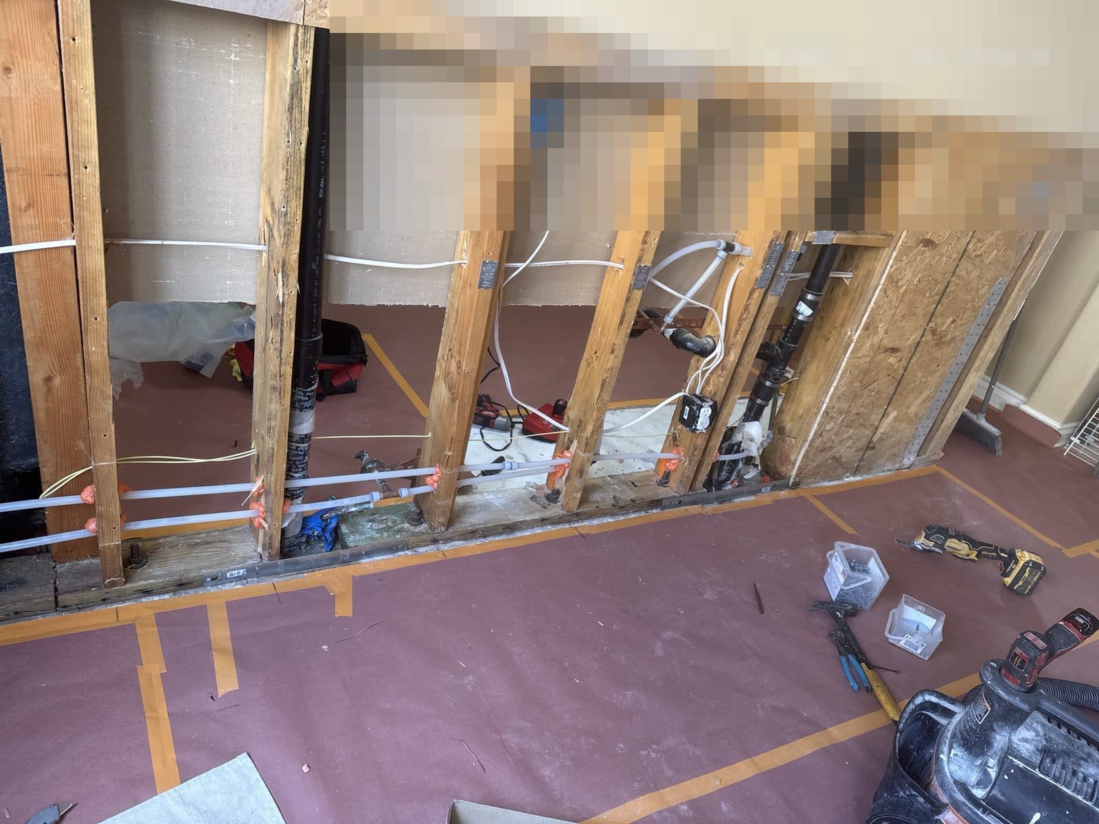 Water damaged wall opened to framing in Corona CA home before insurance claim repair — photo 2