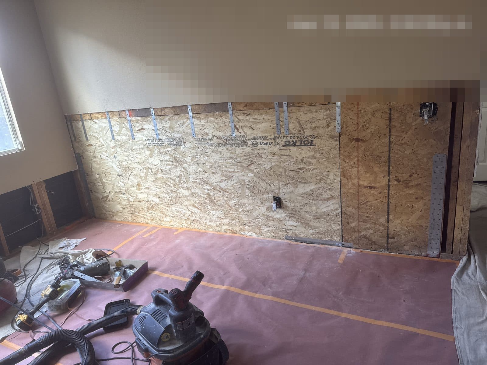 Water damaged wall opened to framing in Corona CA home before insurance claim repair — photo 3