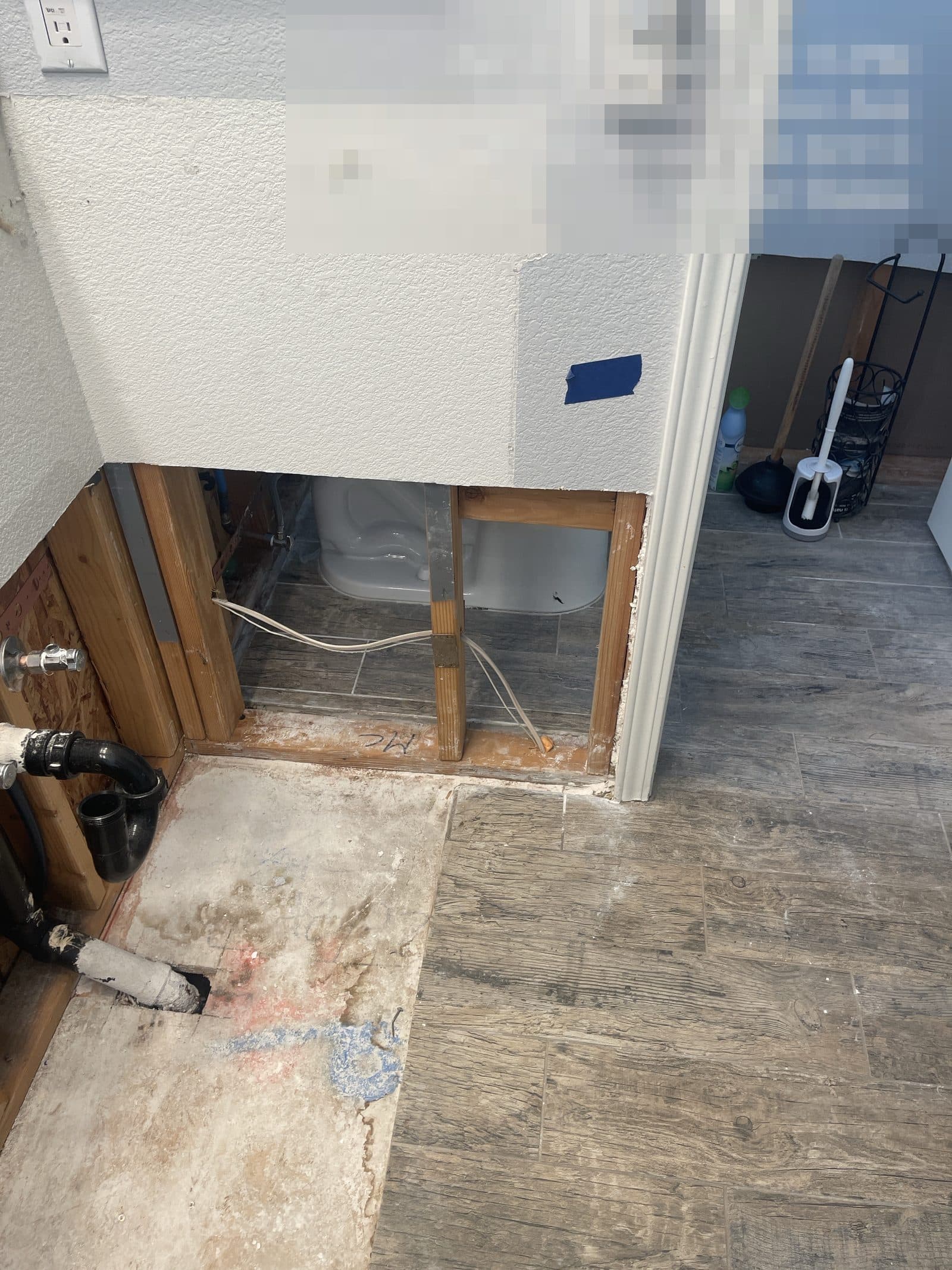 Bathroom wall opened to studs after plumbing failure in Grand Terrace CA, before rebuild — photo 3